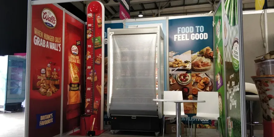 Fully branded high striker on a food brand exhibition stand